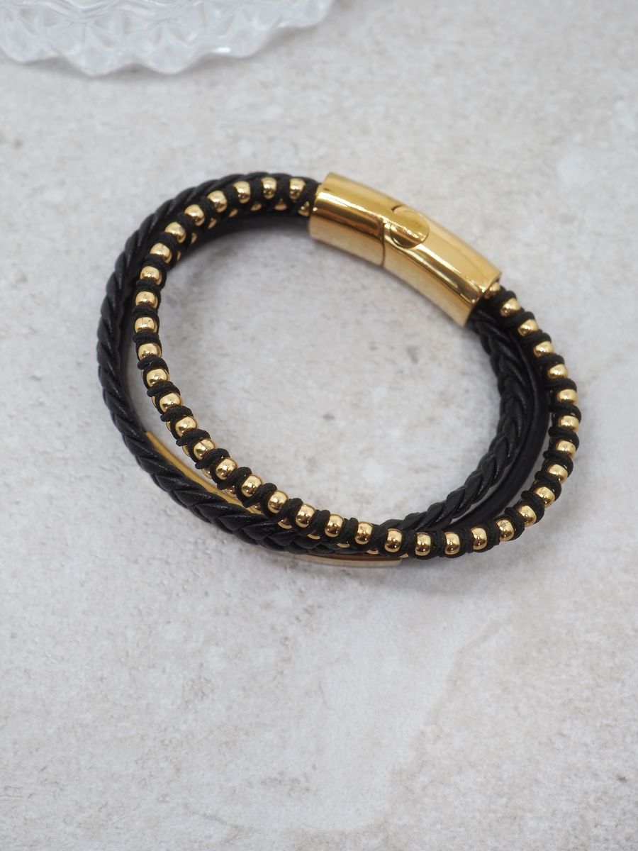 Svart skinnarmbånd med 3 linjer i stål