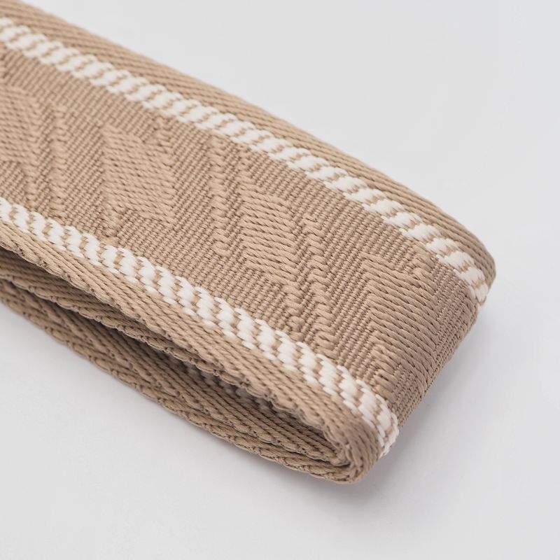 Veskestropp med houndstooth mønster med skinndetaljer lysetaupe