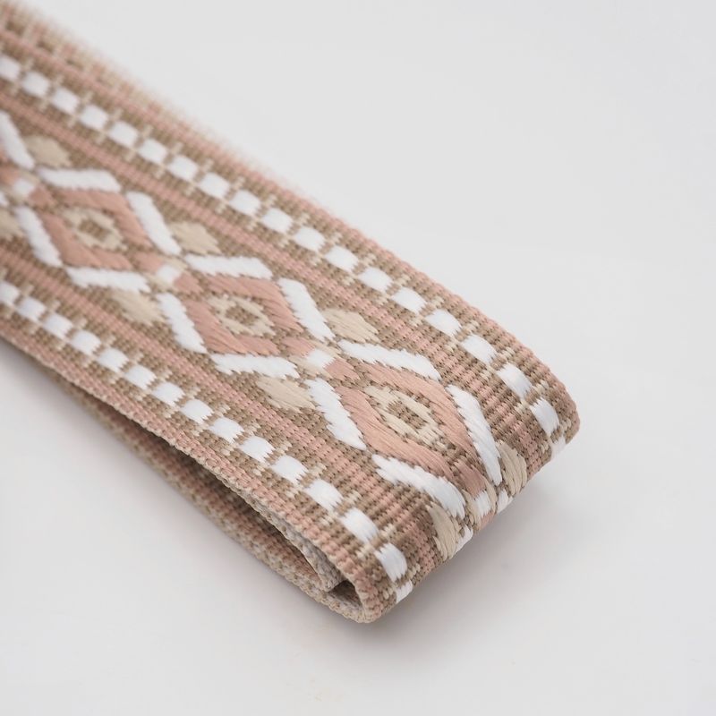 Veskestropp med geometrisk mønster beige krem